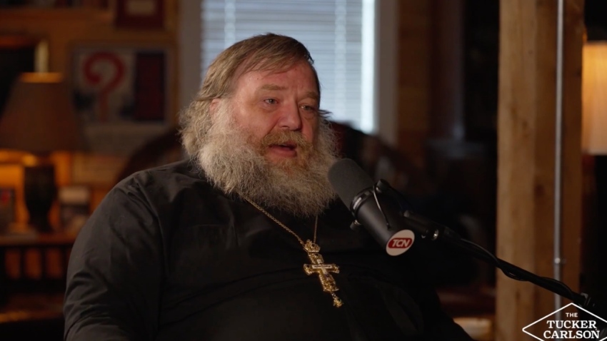 Father Stephen De Young speaks with podcast host Tucker Carlson during an episode of his eponymous show that aired May 29, 2026.