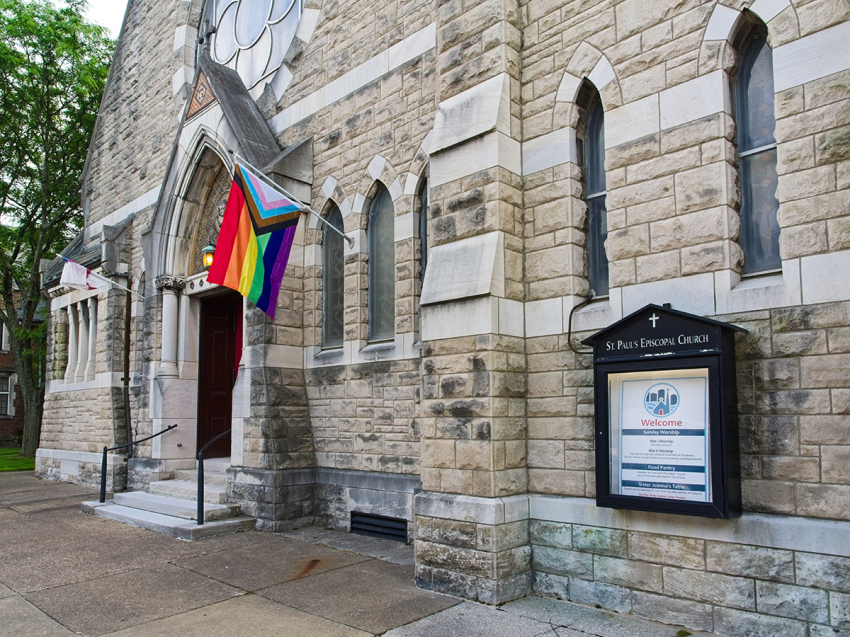 Saint Paul's Episcopal church in downtown Evansville Indiana, with a progress price flag out front. Evansville the third largest city in Indiana is a major Midwest city along the banks of the Ohio river across from Kentucky.