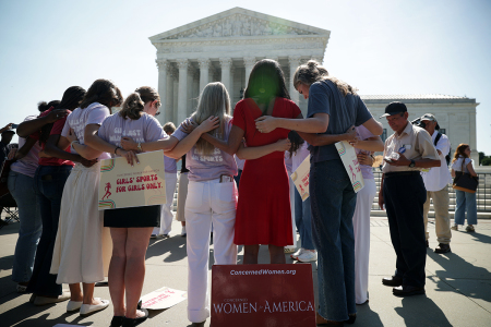 Defenders of female sports categories gather in front of the U.S. Supreme Court as they wait for rulings on June 30, 2026, in Washington, D.C. Today, the Supreme Court upheld state restrictions on male athletes competing in female sports. 