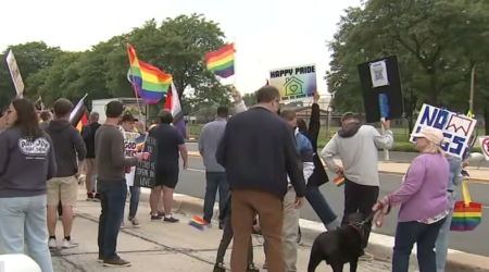 A screenshot of video footage from a protest outside New Hope Community Church in Palatine, Illinois, on June 26, 2026.