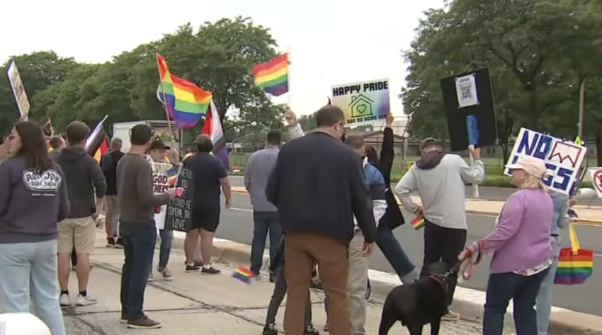 A screenshot of video footage from a protest outside New Hope Community Church in Palatine, Illinois, on June 26, 2026.