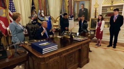 President Donald Trump invites the three Presidential 1776 Award finalists into the Oval Office, where he presents each with a Presidential Challenge Coin on June 30, 2026.