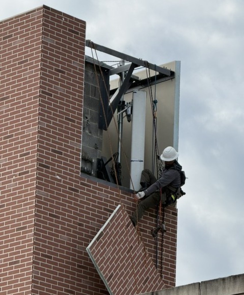 Crews work on the roof of St. Luke Lutheran Church in Silver Spring, Maryland.