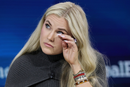 Erika Kirk, CEO and chair of the Board of Turning Point USA, wipes away tears as she speaks onstage during the 2025 New York Times Dealbook Summit at Jazz at Lincoln Center on Dec. 03, 2025, in New York City.