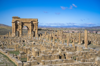 Arch of Trajan and Roman ruins in Timgad, Algeria.