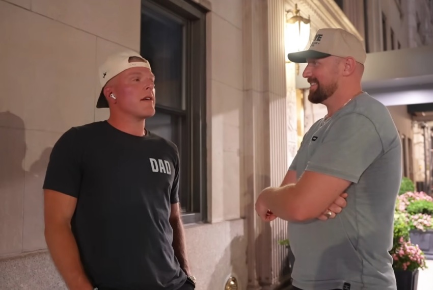 Television personality and former NFL punter Pat McAfee (left) is interviewed by the Reel Evangelism street evangelism ministry in New York in a video published on July 23, 2026. 