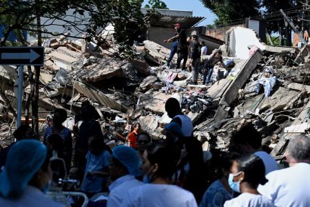 People work on a collapsed building after an earthquake in Cali, Colombia on Aug. 10, 2026. A powerful earthquake rocked Colombia and neighboring Latin American countries on Aug. 10, 2026, with medical teams rushing to help victims after buildings were damaged or collapsed in several cities.