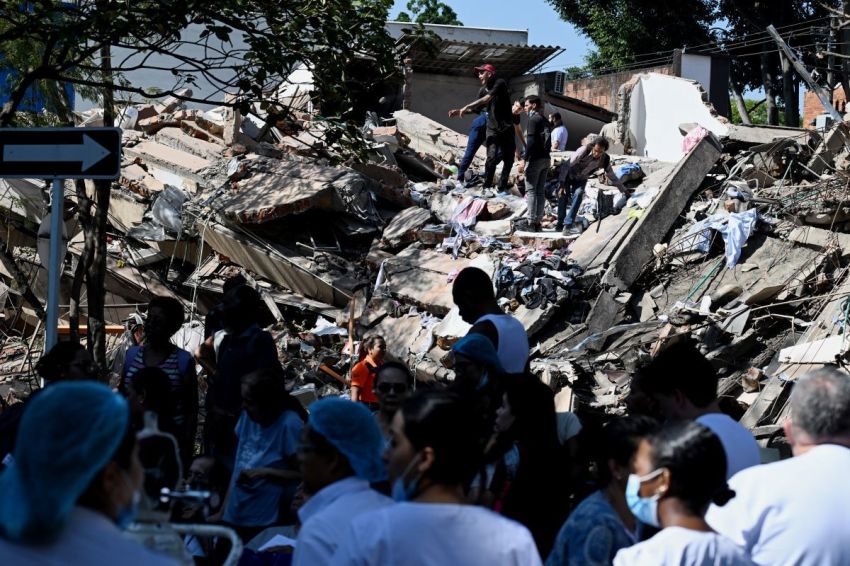 People work on a collapsed building after an earthquake in Cali, Colombia on August 10, 2026. A powerful earthquake rocked Colombia and neighboring Latin American countries on August 10, 2026, with medical teams rushing to help victims after buildings were damaged or collapsed in several cities.