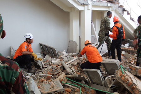 A rescue team searches for victims in the ruins of the Laurensius Say Port in Maumere, Sikka, East Nusa Tenggara on Aug. 15, 2026, after a magnitude 7.7 earthquake struck Flores Island.