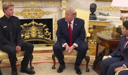 President Donald Trump (center) meets with lifeguard Ryder Williams (left) and Nathaniel Ray (right), the 10-year-old boy he rescued from heavy surf in Santa Cruz, California, at the White House, Aug. 17, 2026.