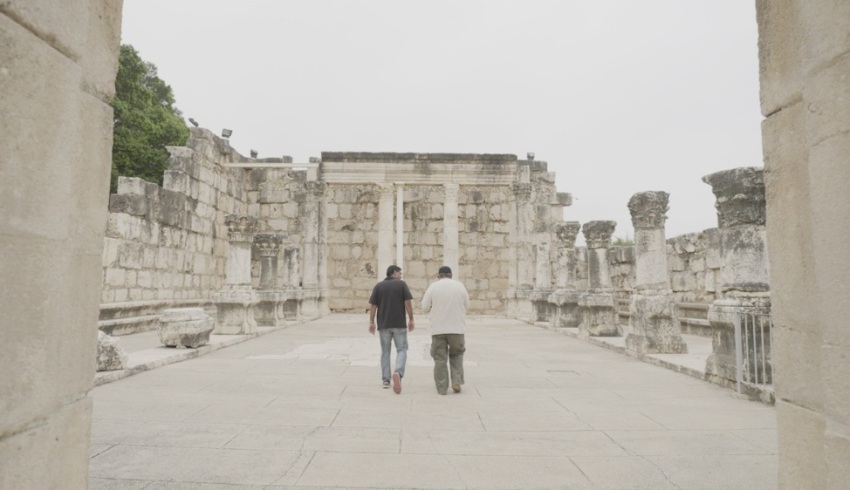 Dinesh D'Souza walks among the ruins of the synagogue in Capernaum in modern day Israel. D'Souza's book