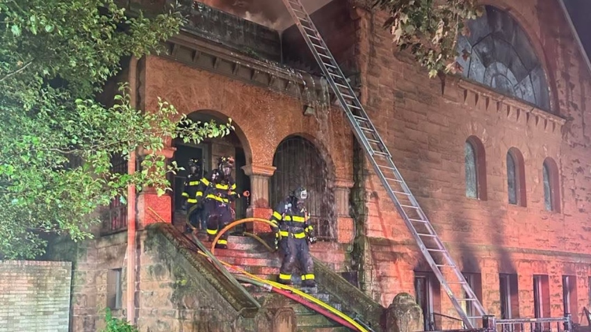 Firefighters attend to the fire that damaged a building on the campus of LaGrave Avenue Christian Reformed Church in downtown Grand Rapids, Michigan, on Aug. 26, 2026.