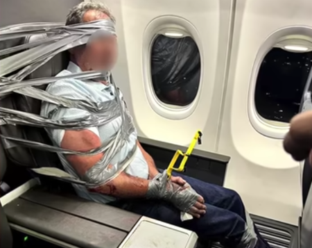 An unruly passenger is restrained with duct tape after having a violent exchange with author and minister Jonathan Cahn on a flight from Dallas, Texas to Newark, New Jersey, Sept. 3, 2026.