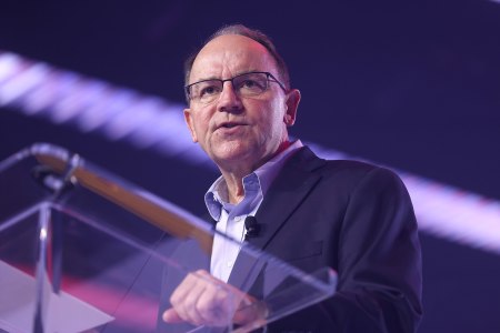 U.S. Congressman Tom Tiffany speaks with attendees at the 2025 AmericaFest at the Phoenix Convention Center in Phoenix, Arizona.