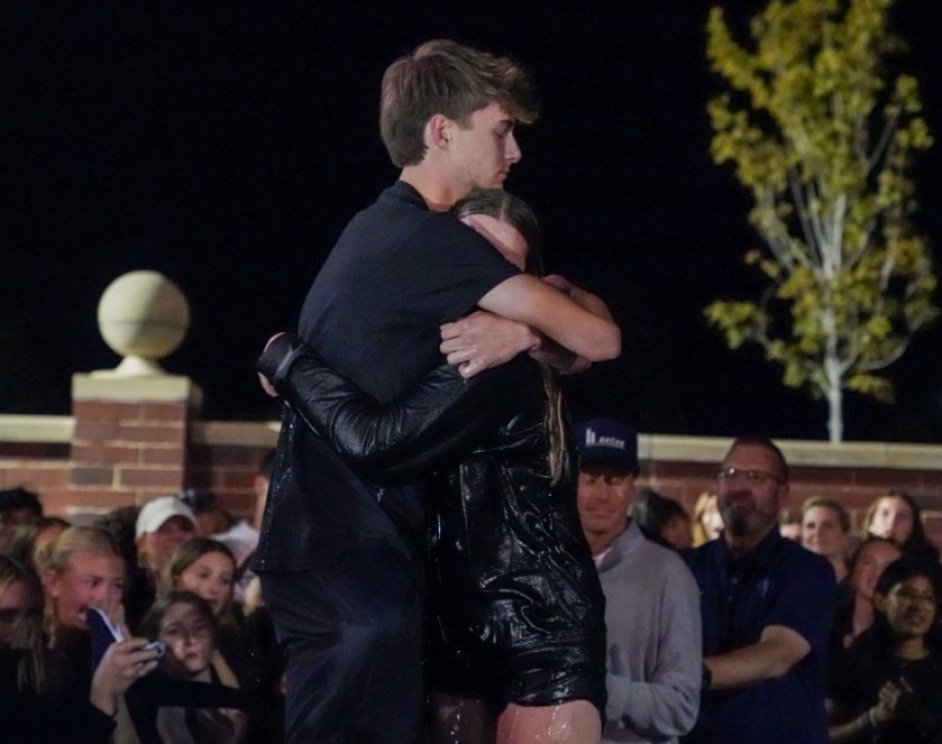 High school senior Clayton Lumpkin hugs his sister, freshman Annika Lumpkin, after assisting in her baptism at the 5th Quarter gathering at Valor Christian High School of Highlands Ranch, Colorado, on Friday, Sept. 18, 2026.