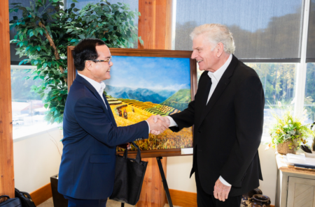 Nguyen Dinh Khang (left), Vietnam's minister of ethnic and religious affairs, presents the Rev. Franklin Graham (right), CEO of the Billy Graham Evangelistic Association, with a painting of a rice harvest as a token of friendship during a meeting in North Wilkesboro, North Carolina, Oct. 14, 2026.