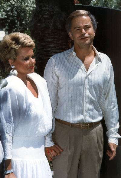 The Rev. Jim Bakker and his wife Tammy Faye Bakker are shown at their first press conference on May 1, 1987, in Palm Springs, California, since Bakker was forced out of PTL church. (Photo credit should read SCOTT MILIMAN/AFP via Getty Images)