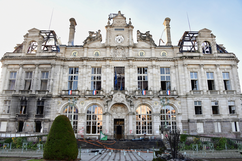 This photograph shows the partially burned facade of the Limoges city hall a day after riot and looting following violent riots nationwide, including in Limoges on Oct.18, 2026. France's Prime Minister said over 1,200 people were arrested in protests across the country on Oct. 17, and 150 police were hurt during clashes between police and protesters. Massive looting, multiple blazes and violence gripped France.