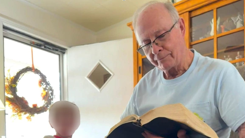 An undated photo of Bobby McGill reading a Bible.