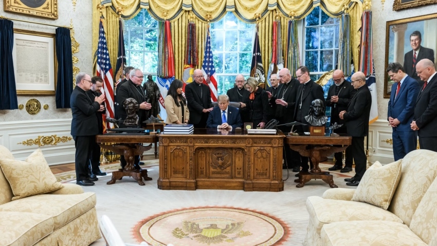 Twelve Roman Catholic bishops pray over President Donald Trump during an Oval Office meeting on Oct. 22, 2026. Denver Archbishop James Golka leads the prayer with his hand on Trump's shoulder.