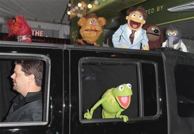 Muppets cast members Kermit the Frog, Animal (top L), Fozzie Bear (2nd L), Walter (3rd L), Rowlf (2nd R), and Gonzo (R) arrive at the "The Muppets" world premiere in Hollywood, Calif., Nov. 12.