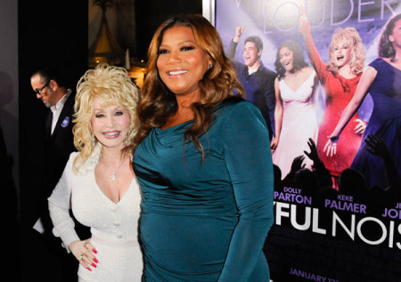Cast members Dolly Parton (L) and Queen Latifah (R) arrive at the Hollywood premiere of "Joyful Noise" in Los Angeles, California January 9, 2012.