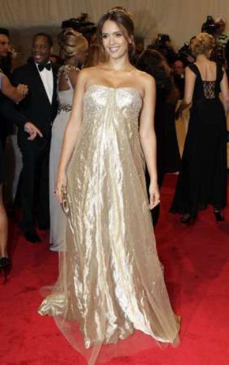 Actress Jessica Alba poses on arrival at the Metropolitan Museum of Art Costume Institute Benefit celebrating the opening of the exhibition "Alexander McQueen: Savage Beauty" in New York May 2, 2011.