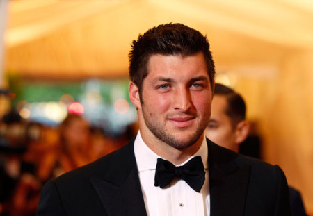 New York Jets quarterback Tim Tebow arrives at the Metropolitan Museum of Art Costume Institute Benefit celebrating the opening of "Schiaparelli and Prada: Impossible Conversations" exhibition in New York, May 7, 2012.