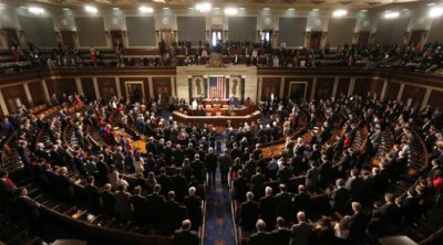 Members of the 113th Congress bow their heads in prayer as they convene in the Capitol in Washington January 3, 2013. In the wake of bruising fights in their own ranks over the "fiscal cliff" and aid for victims of superstorm Sandy - Republicans in the U.S. House of Representatives open a new Congress on Thursday more divided than ever.