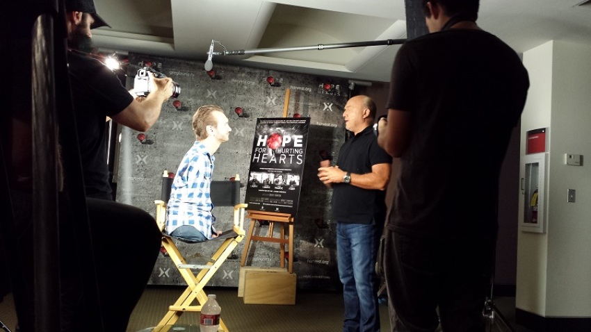 Pastor Greg Laurie talks with evangelist Nick Vujicic before advance screening of film, "Hope For Hurting Hearts," June 30, 2013.