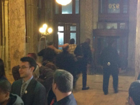 A same-sex marriage protester is removed from Newark's City Hall on Monday, Oct. 21, 2013, after declaring that gay marriage was 