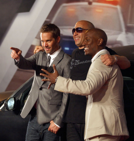 Actors (L-R) Paul Walker, Vin Diesel and Tyrese Gibson pose at the world premiere of "Fast Five" at the Cinepolis Lagoon theatre in Rio de Janeiro April 15, 2011. The movie, the fifth in the Fast and Furious film series, opens in theaters on April 29.