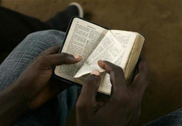 Boy holding a bible