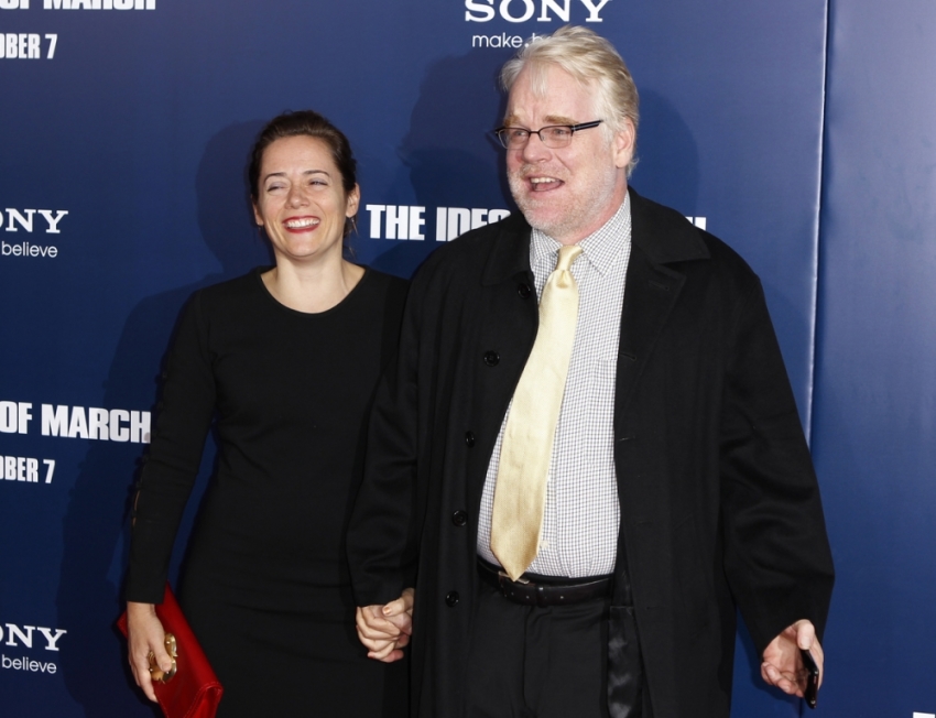 Philip Seymour Hoffman arrives with Mimi O'Donnell at the premiere of Ides of March in New York October 5, 2011.