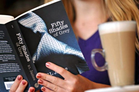 A woman reads E.L. James'