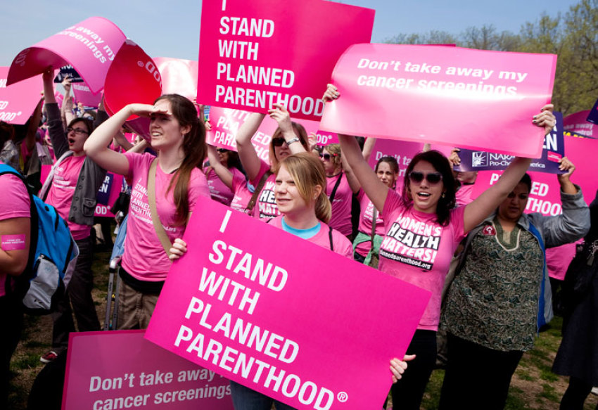 Members of Planned Parenthood, NARAL Pro-Choice America and more than 20 other organizations hold a 