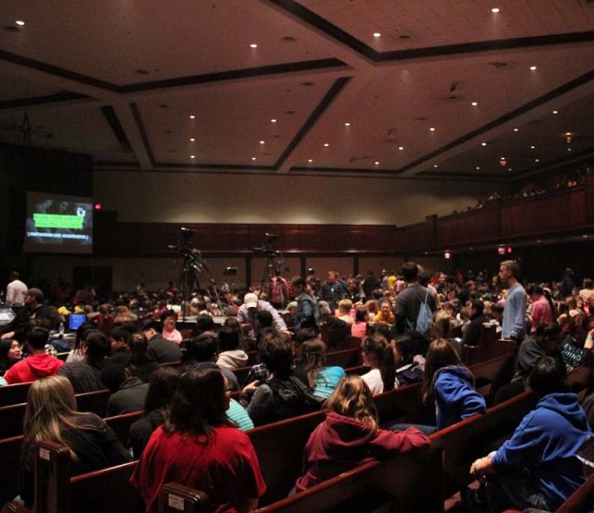 Attendees fill into the Hylton Memorial Chapel in Woodbridge for "Reverse", a youth event organized by Dare 2 Share Ministries on the evening of Friday, March 28, 2014.
