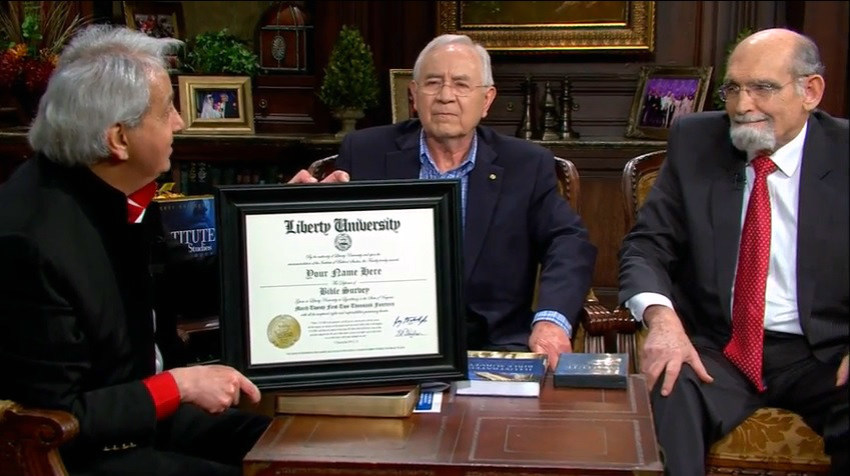 Evangelist Benny Hinn discusses on his "This Is Your Day" television program the Institute of Biblical Studies from Liberty University, with guests Dan Reber and Dr. Ronald Godwin, senior vice president for Academic Affairs and Provost for the university.