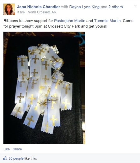 Arkansas church members organized a prayer meeting in a local park and crafted white "prayer ribbons" with gold crosses to support Cloverdale Assembly of God Church pastor John Martin and his wife Tammie as they travel to West Africa despite concerns about the spread of Ebola in the continent.