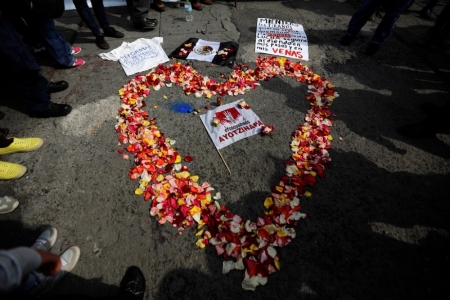 Flowers arranged in the shape of a heart are seen during a protest to demand more information about the missing students of the Ayotzinapa Teachers' Training College