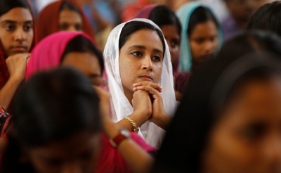 Women attend a mass inside a church to celebrate Easter in the southern Indian city of Chennai March 31, 2013.