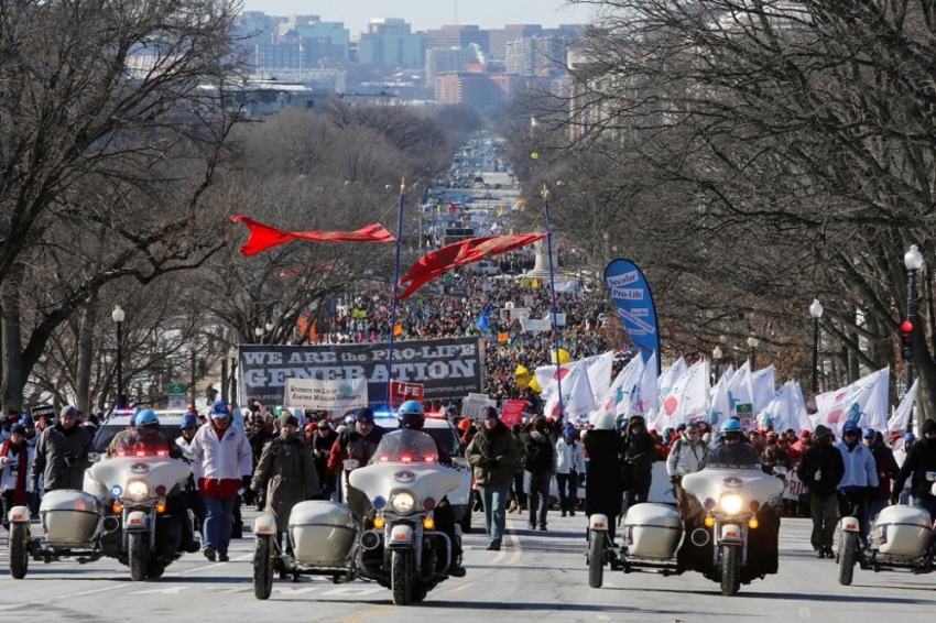 Pro-life activists participate in the annual March for Life in Washington, January 22, 2014. Pope Francis used Twitter to back the annual anti-abortion rally, which was expected to draw hundreds of thousands of activists to Washington on Wednesday.