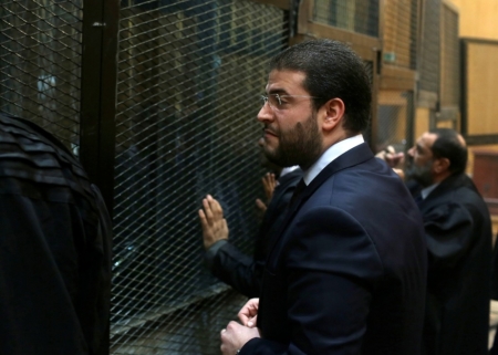 Osama Mohamed Morsi, son of Egypt's ousted president Mohamed Morsi, talks to Muslim Brotherhood members before the trial of the members including his father at a court on the outskirts of Cairo, Egypt, December 14, 2014. Egypt declared Mohamed Mursi's Muslim Brotherhood a banned terrorist organization last December and Egyptian courts have sentenced hundreds of the group's members to death in mass trials that have drawn strong international criticism.