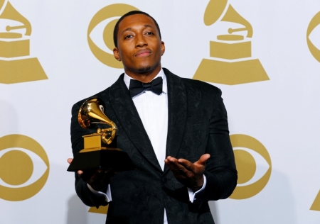 Lecrae poses with his award for Best Contemporary Christian Music Performance/Song for "Messengers" backstage at the 57th Annual Grammy Awards in Los Angeles, California, February 8, 2015.