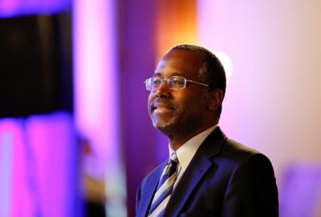 Ben Carson, a retired surgeon popular with Tea Party conservatives, waits to speak at a luncheon during the Republican National Committtee's