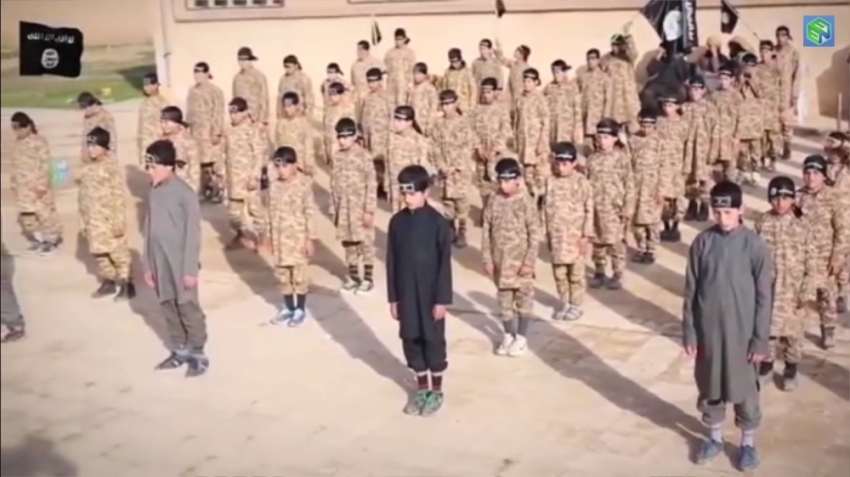 ISIS has released a slickly-edited propaganda video showing boys as young as 5 being indoctrinated at a military-style training camp for "cubs," February 2015.