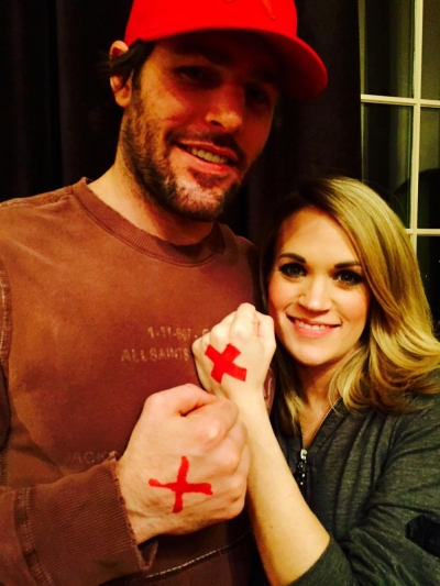 Carrie Underwood and Mike Fisher show their support of the #EndItMovement" on Feb. 26, 2015.