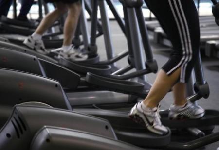 Clients work out on machines in Arvada, Colorado.