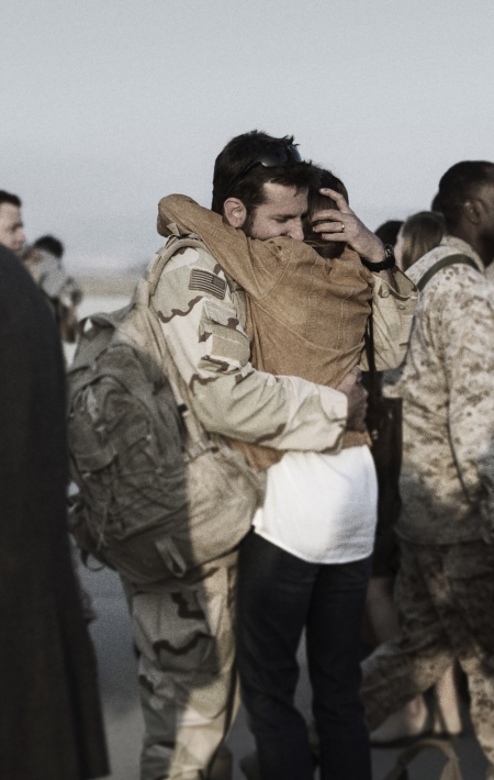 Bradley Cooper and Sienna Miller portray Chris and Taya Kyle in the 2014 film "American Sniper."