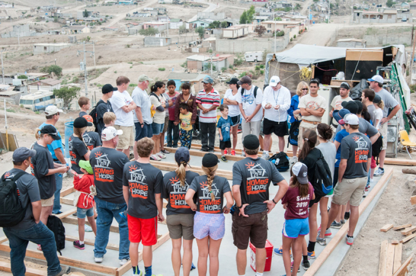 Volunteers gather for a "Homes for Hope" project.